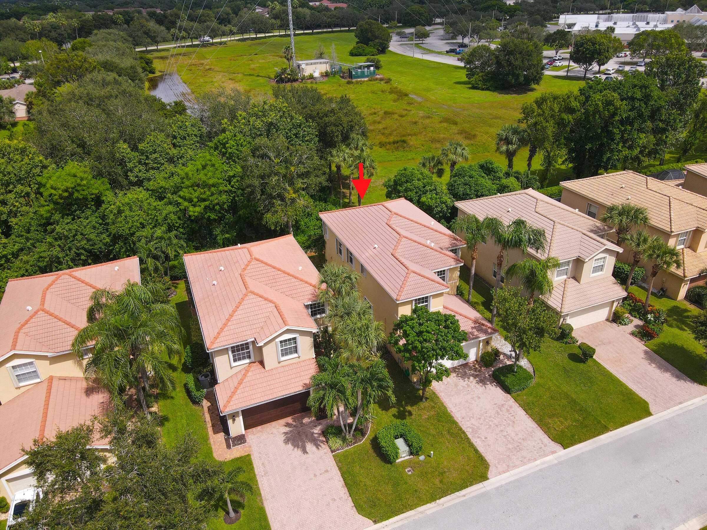 10208 White Water Lily Way Boynton Beach, FL 33437 - Photo 32 of 38 an aerial view of a house with a garden and lake view