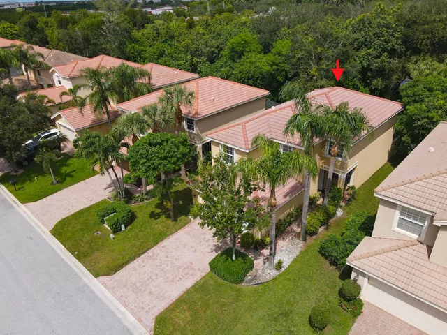 an aerial view of houses with yard