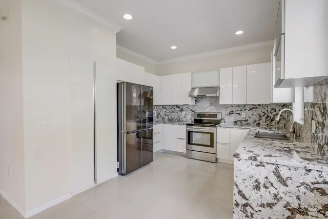 a bathroom with a double vanity sink and a large mirror
