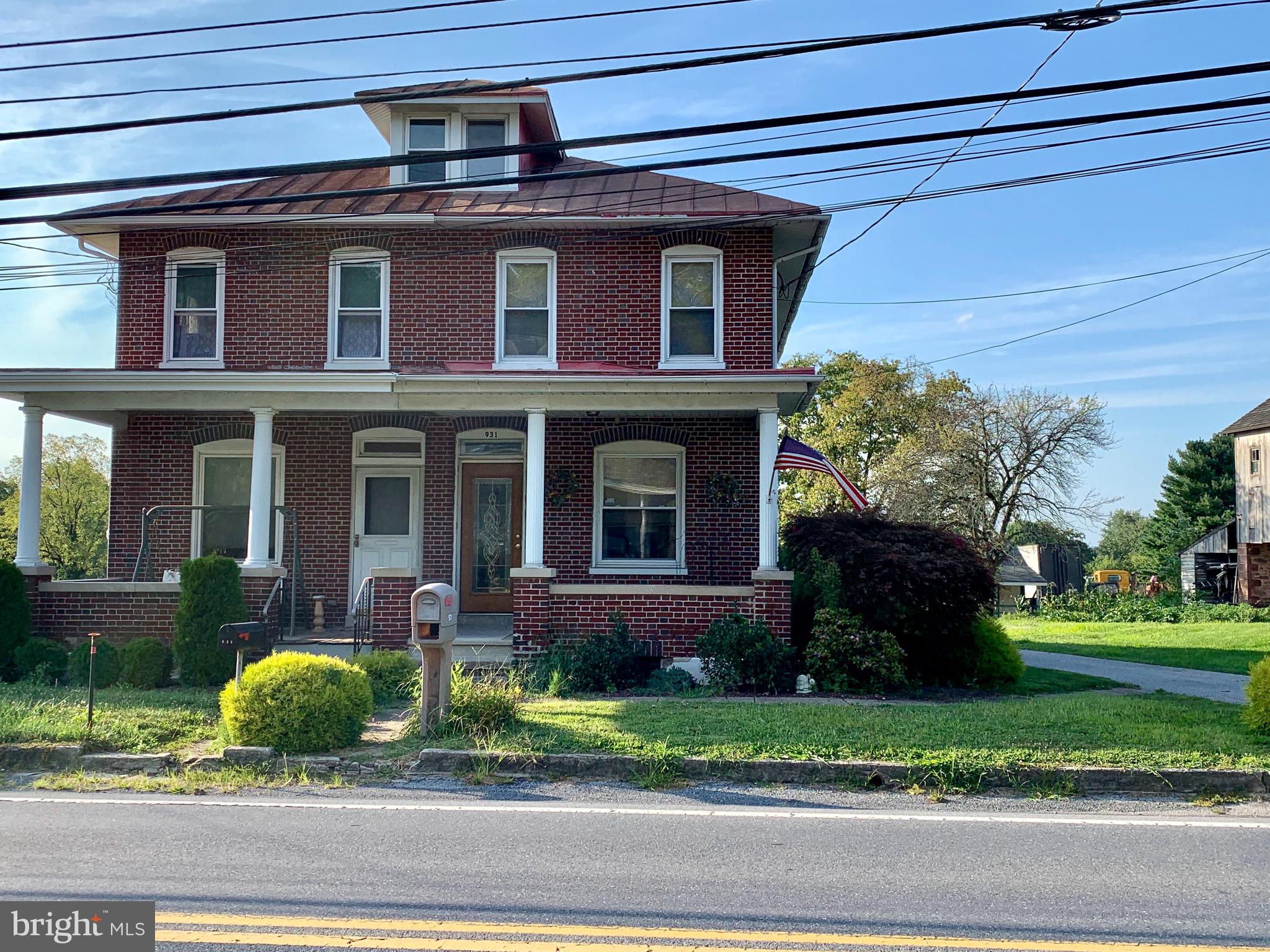 931 Fritztown Road Reading, PA 19608 - Photo 2 of 12 a front view of a house with a yard and potted plants