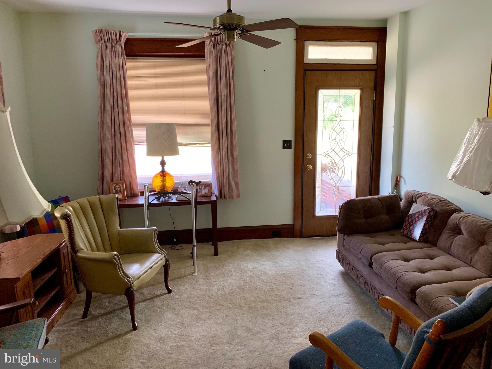 931 Fritztown Road Reading, PA 19608 - Photo 5 of 12 a living room with furniture and a window