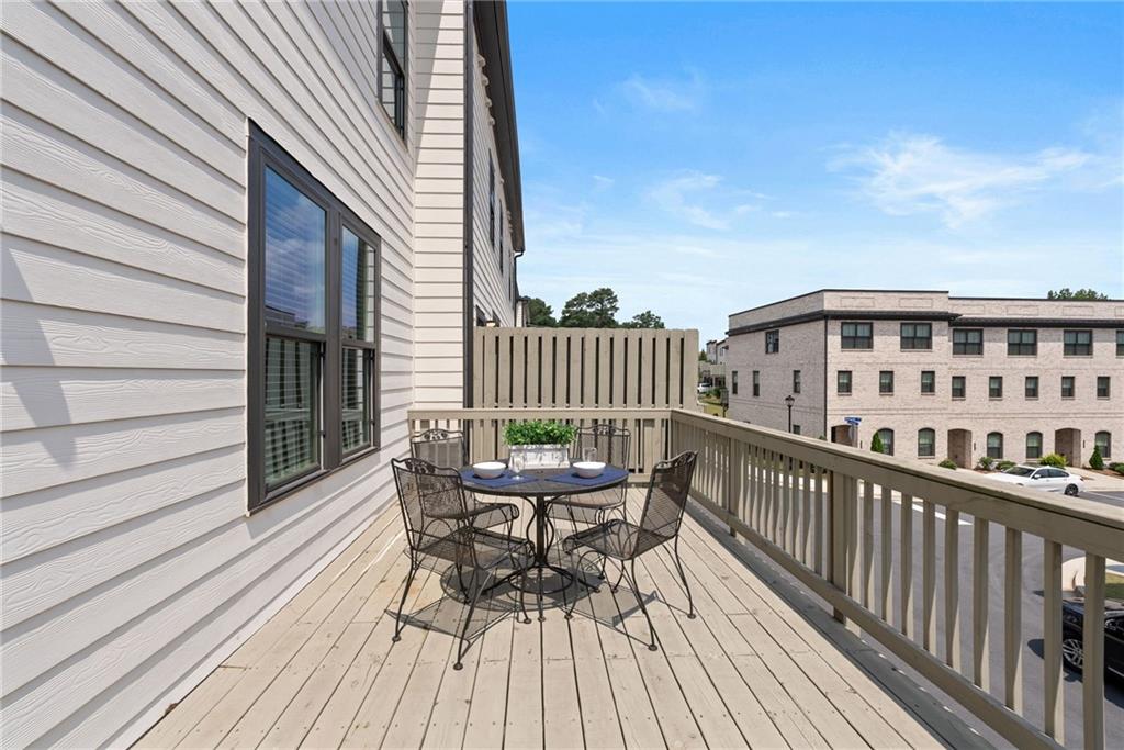 3334 Swallowtail Terrace Duluth, GA 30096 - Photo 25 of 37 a view of balcony with deck wooden floor and outdoor seating