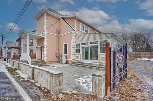 a front view of a house with large windows