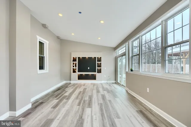 a workspace with a table and chairs
