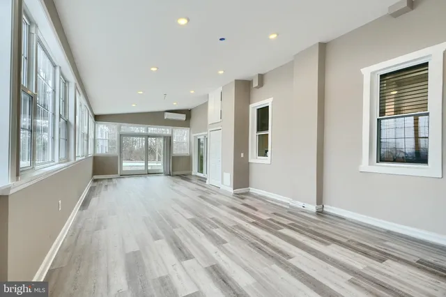 a bedroom with a large bed and a couch