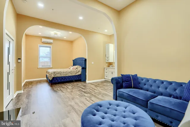 a spacious bathroom with a sink a mirror and shower