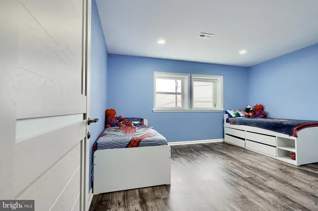 a view of a workspace with furniture and a bedroom