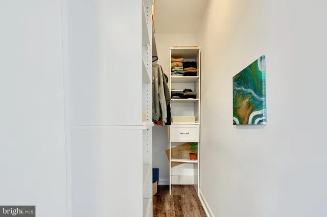 a bed room with a bed and a window