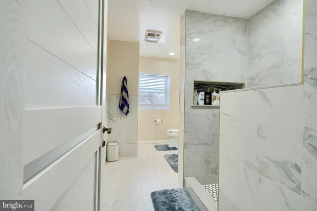 a front view of a building with a yard