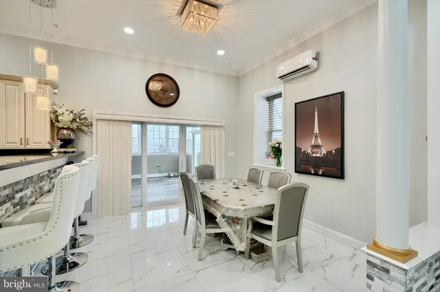a large bedroom with a bed and glass table