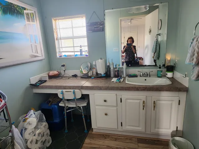 a bathroom with sinks granite countertop a sink and a mirror
