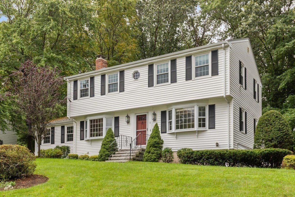 a front view of a house with a yard and porch