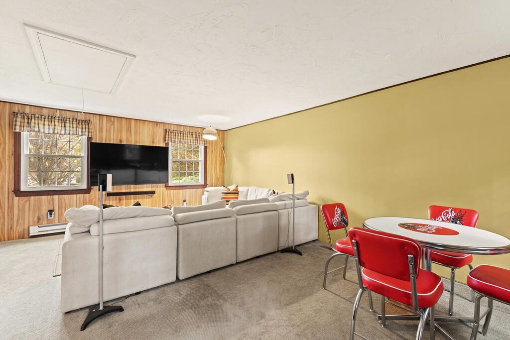 1 Robbin Road Canton, MA 02021 - Photo 18 of 40 a view of a workspace with furniture and a flat screen tv