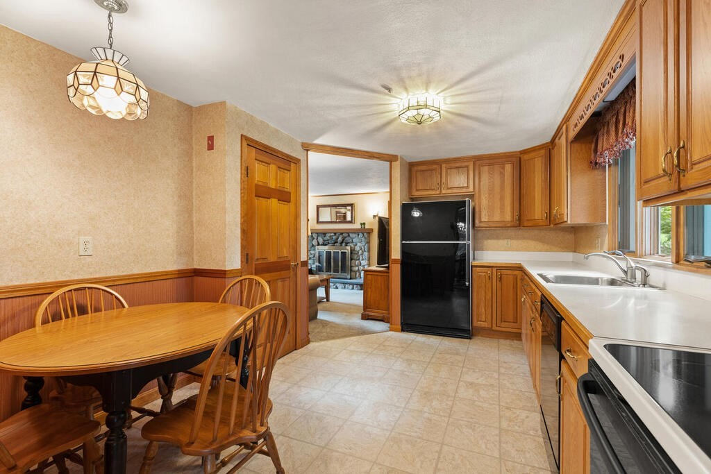 1 Robbin Road Canton, MA 02021 - Photo 24 of 40 a kitchen with stainless steel appliances granite countertop a sink refrigerator and cabinets