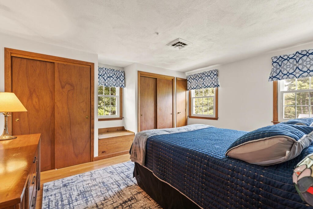 1 Robbin Road Canton, MA 02021 - Photo 30 of 40 a bedroom with a bed and wooden floor