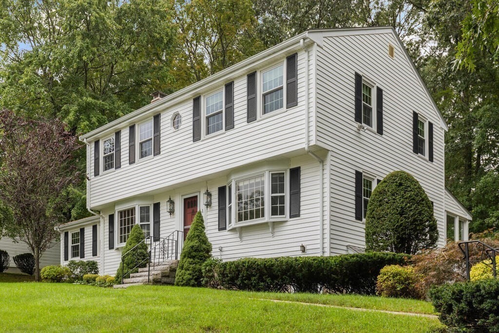 1 Robbin Road Canton, MA 02021 - Photo 3 of 40 a front view of a house with a yard and potted plants