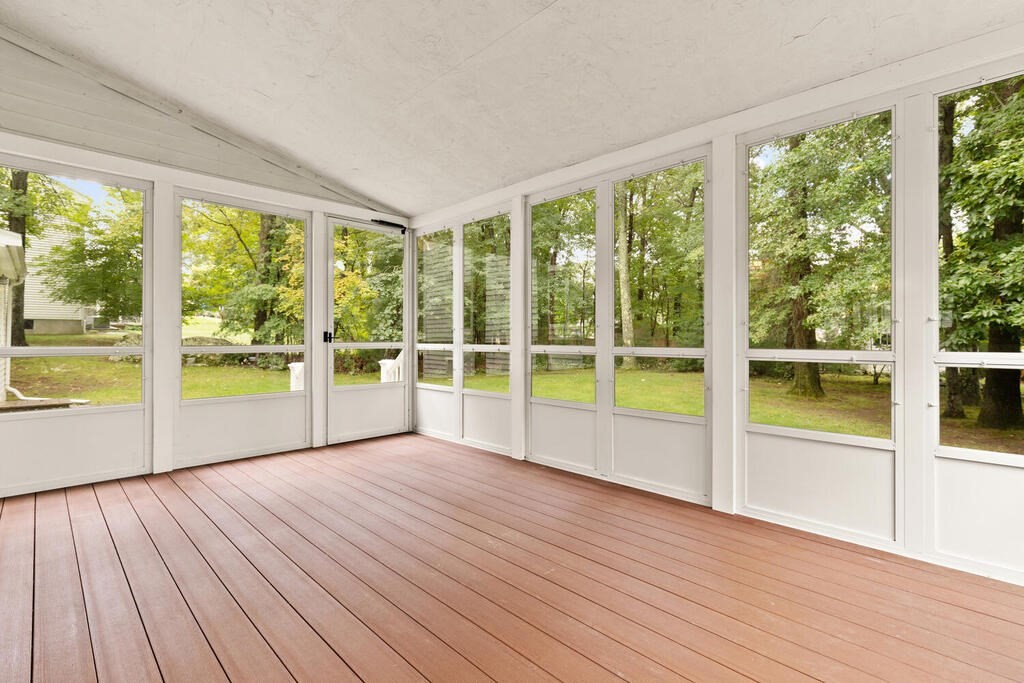 1 Robbin Road Canton, MA 02021 - Photo 32 of 40 a view of an empty room with wooden floor and a window