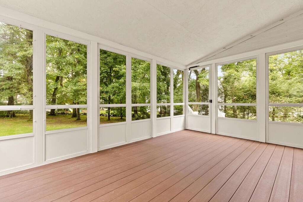 1 Robbin Road Canton, MA 02021 - Photo 33 of 40 a view of an empty room with wooden floor and a window