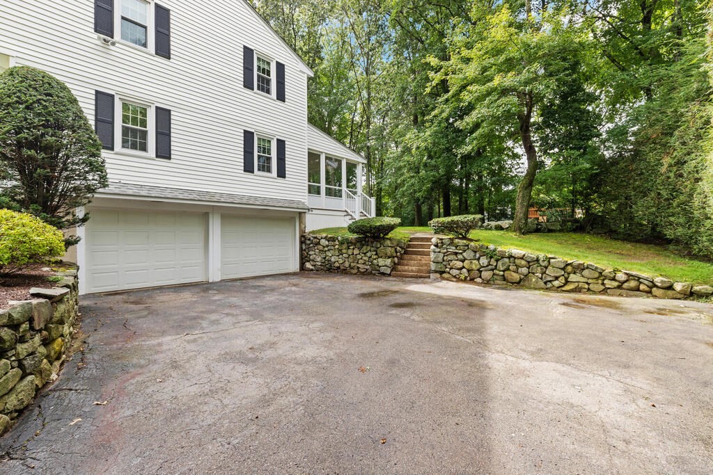 1 Robbin Road Canton, MA 02021 - Photo 36 of 40 front view of a house with a yard and a garage