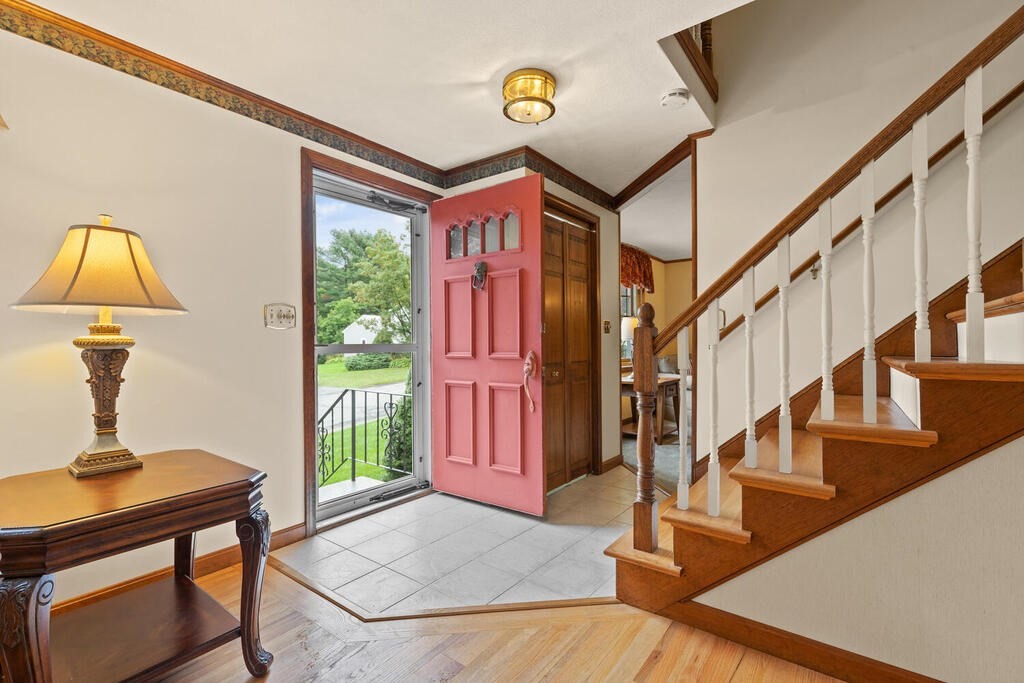 1 Robbin Road Canton, MA 02021 - Photo 6 of 40 a view of entryway livingroom and hall with wooden floor