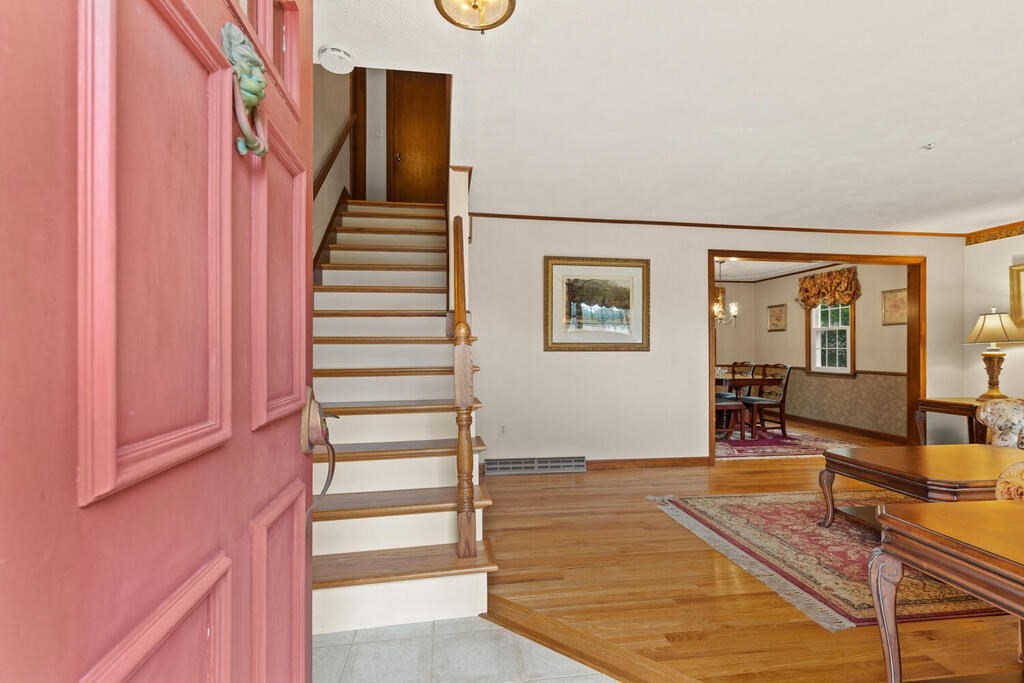 1 Robbin Road Canton, MA 02021 - Photo 7 of 40 a view of a livingroom with furniture and staircase