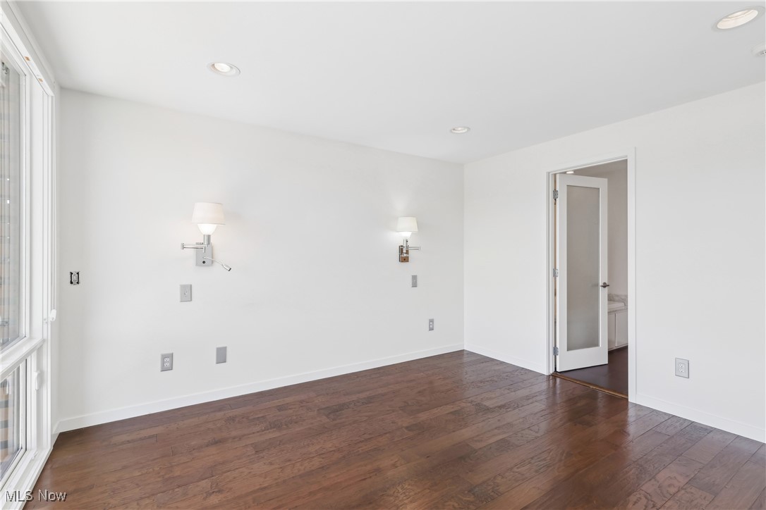 1852 Coltman Road Cleveland, OH 44106 - Photo 20 of 39 Spare room featuring baseboards, wood finished floors, and recessed lighting