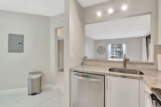 a view of a dining room with furniture and a window