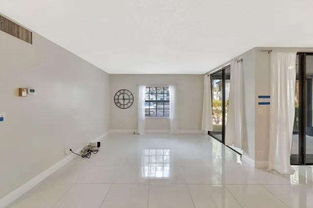 a view of an empty room and a window