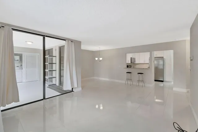 wooden floor in an empty room with a glass door