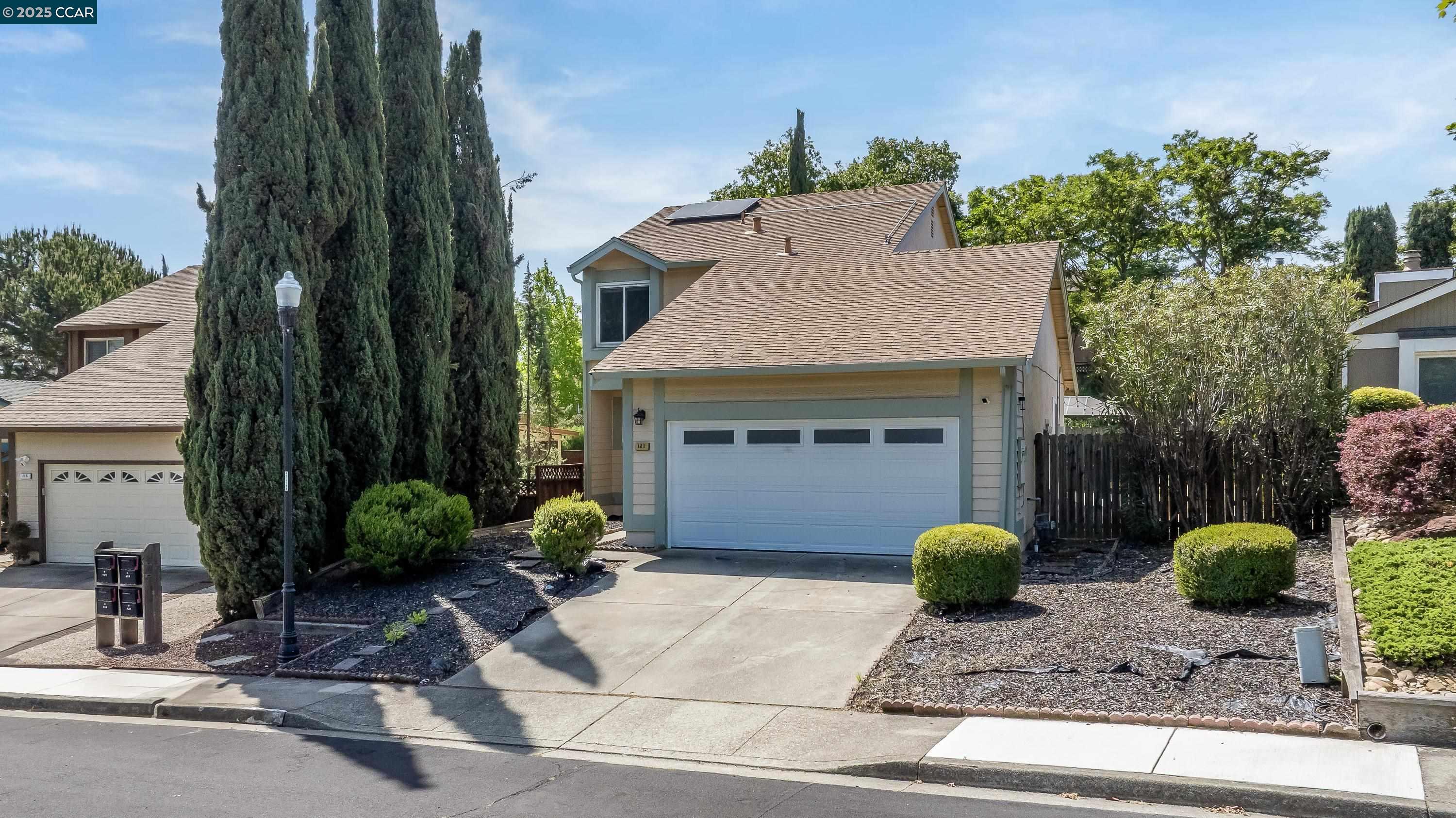 a front view of a house with garden