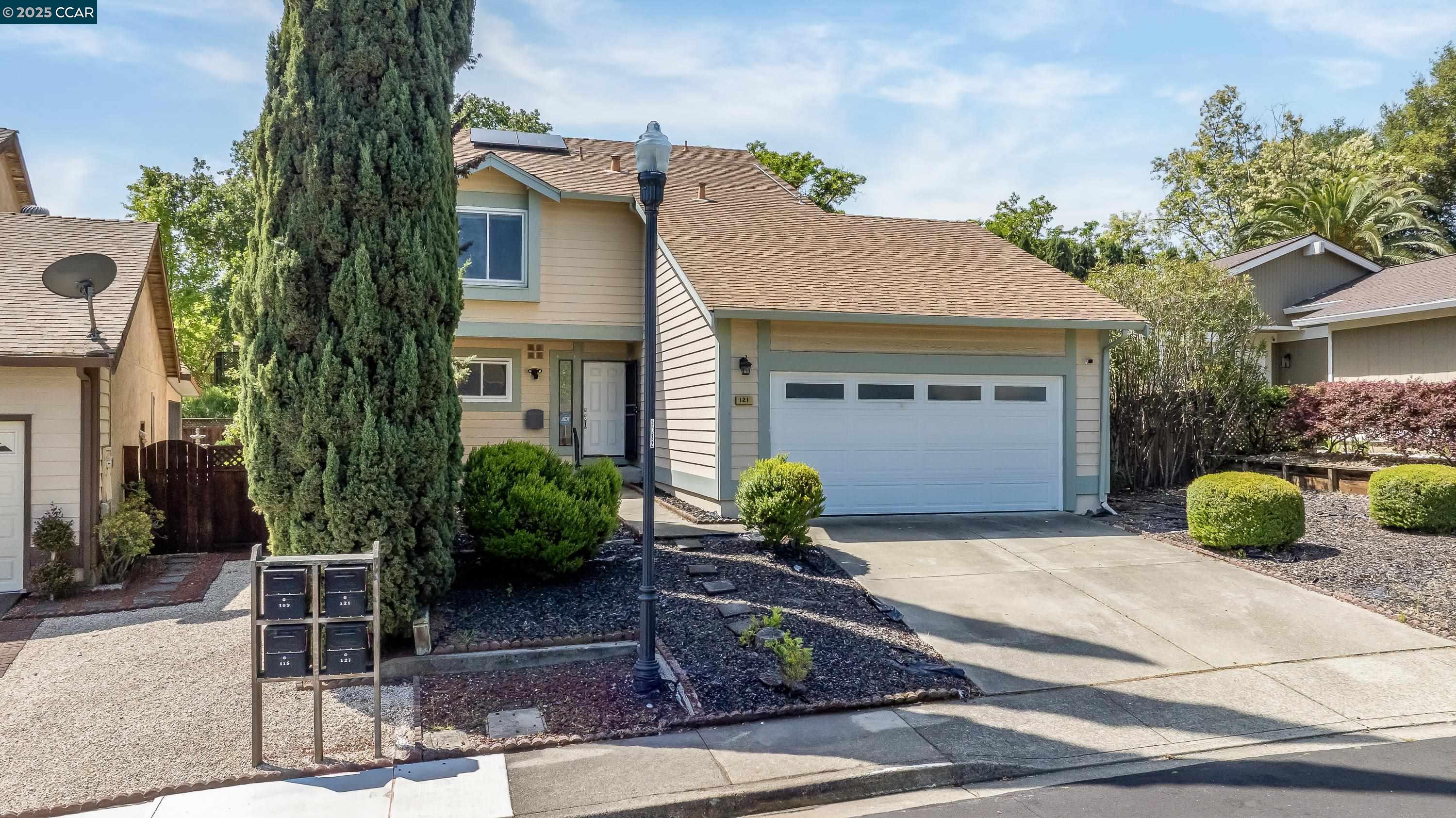 121 Brighton Street Hercules, CA 94547 - Photo 2 of 55 a front view of a house with garden