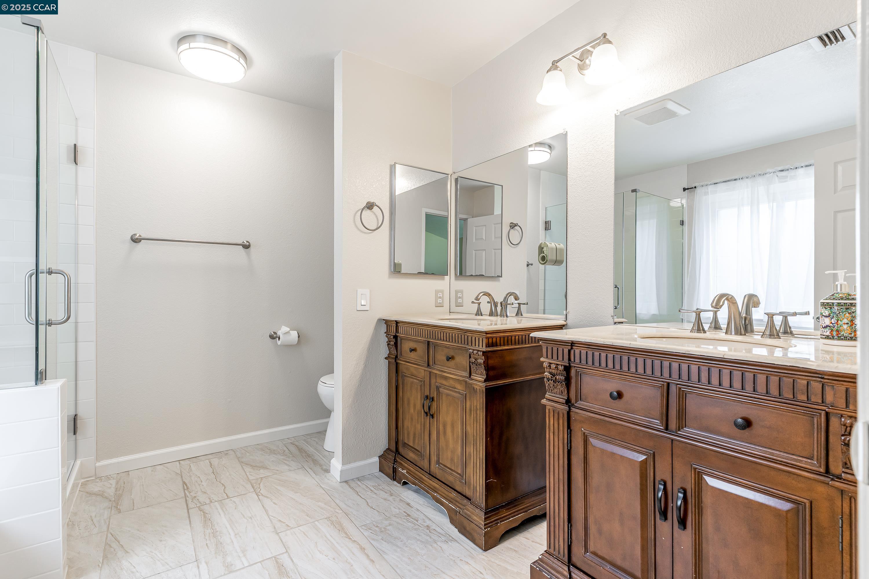 121 Brighton Street Hercules, CA 94547 - Photo 30 of 55 a spacious bathroom with a double vanity sink mirror and