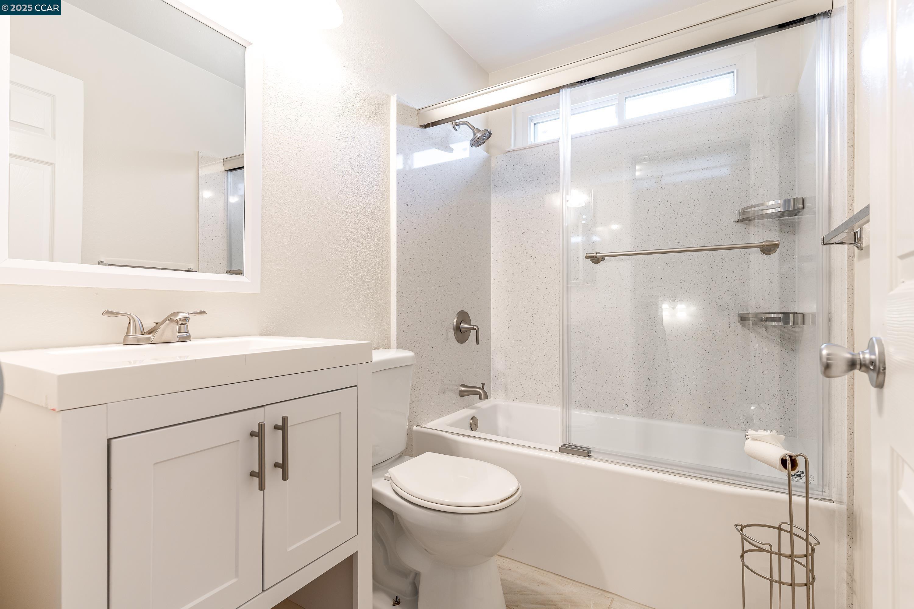 121 Brighton Street Hercules, CA 94547 - Photo 35 of 55 a bathroom with a sink a toilet and shower