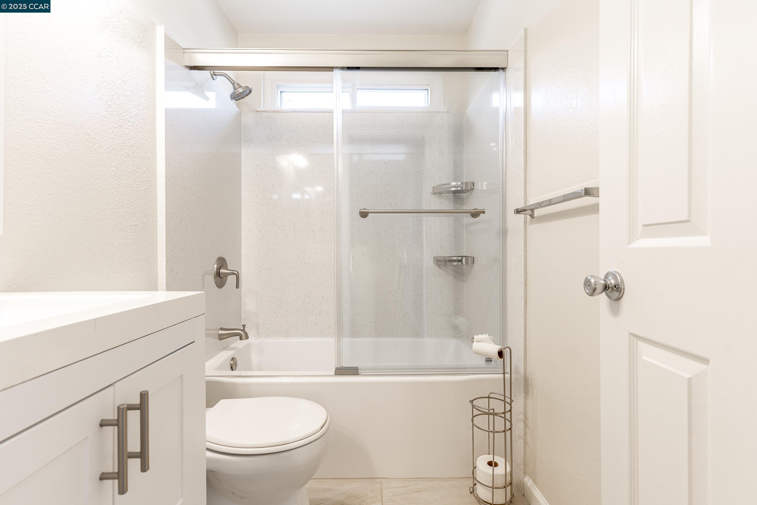 121 Brighton Street Hercules, CA 94547 - Photo 36 of 55 a bathroom with a bathtub shower sink vanity and toilet