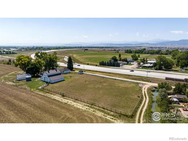 a view of a swimming pool and an outdoor seating