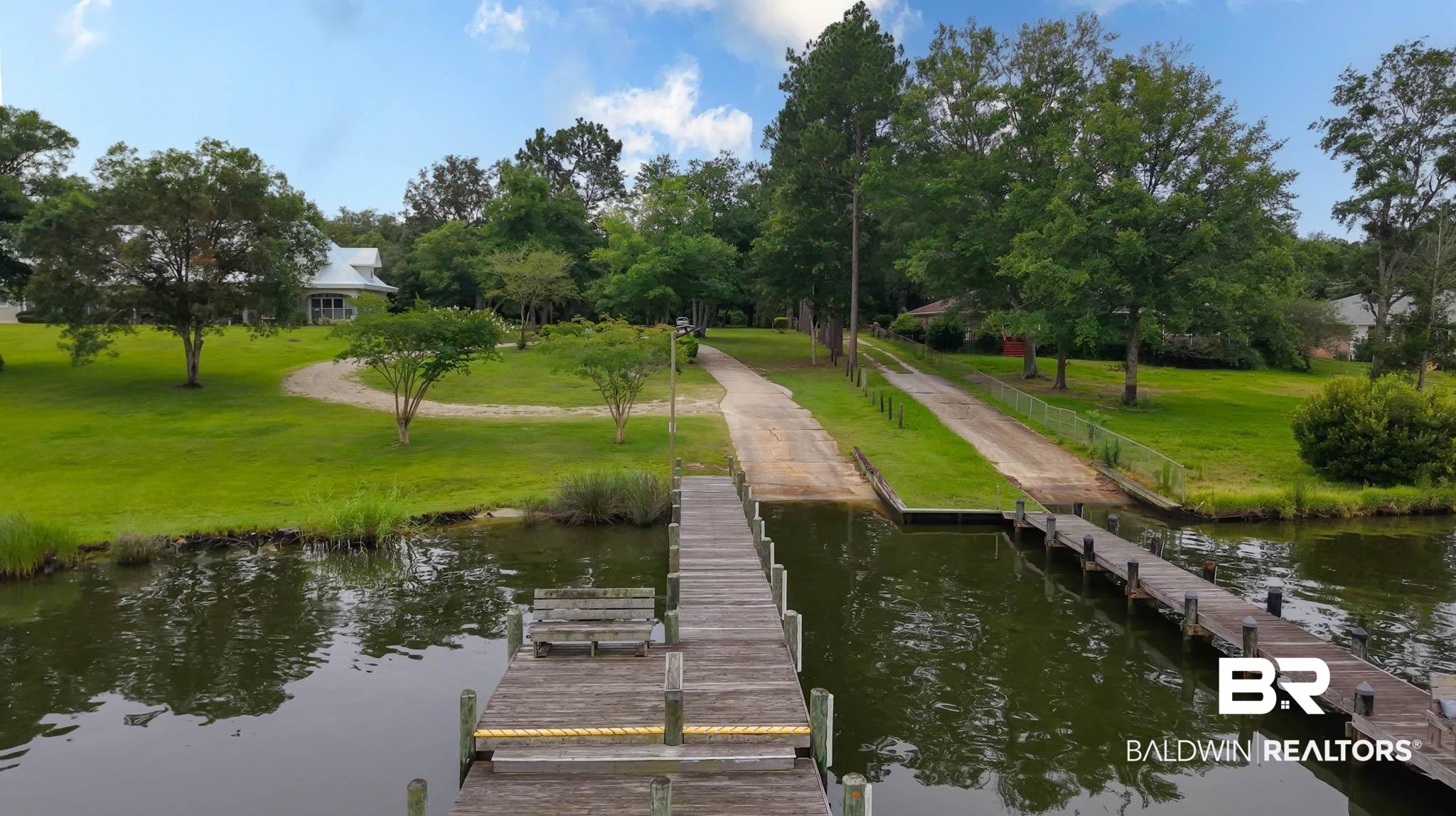 8145 Bay View Drive Foley, AL 36535 - Photo 77 of 81 Dock with a boat ramp, a yard, a water view, and view of wooded area