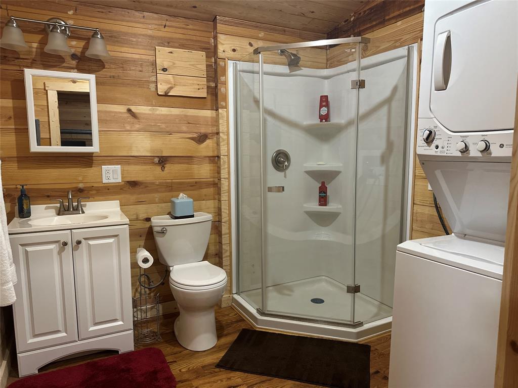 191 Cherry Lane Streetman, TX 75859 - Photo 17 of 40 a bathroom with a granite countertop toilet sink and shower