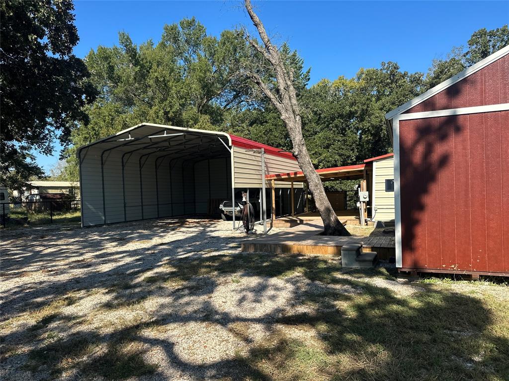 191 Cherry Lane Streetman, TX 75859 - Photo 20 of 40 a view of a house with backyard and trees
