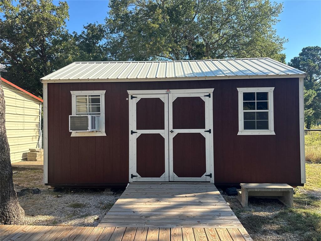 191 Cherry Lane Streetman, TX 75859 - Photo 21 of 40 a view of a house with a door and wooden fence