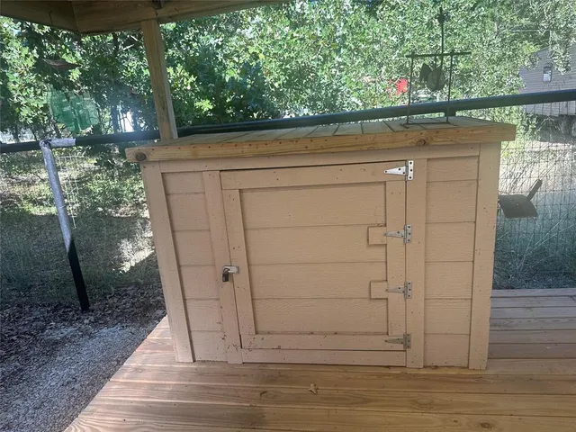 a view of a patio with table and chairs