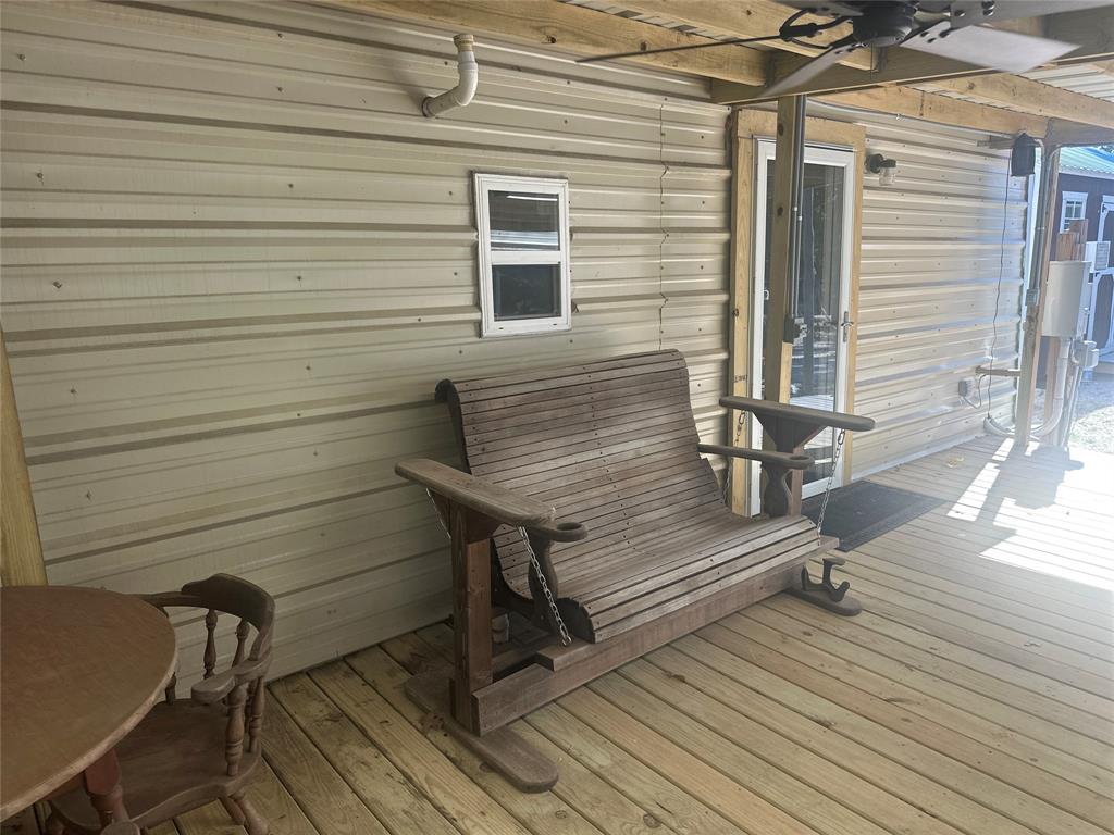 191 Cherry Lane Streetman, TX 75859 - Photo 31 of 40 a view of a wooden chairs on the deck