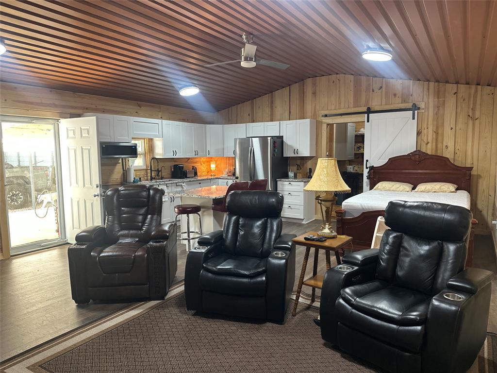 191 Cherry Lane Streetman, TX 75859 - Photo 7 of 40 a living room with furniture and a flat screen tv
