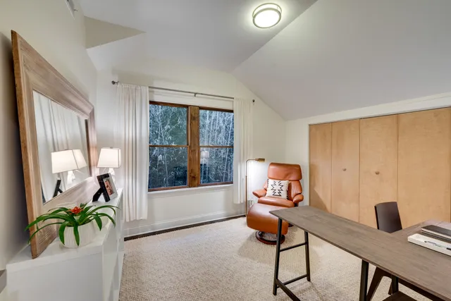 a workspace with furniture and window