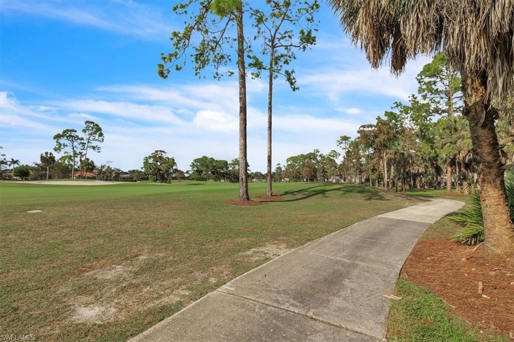 8075 Tiger Cove, Unit 1706 Naples, FL 34113 - Photo 38 of 50 View of community featuring a view of golf course