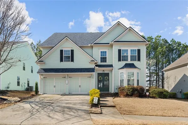 a front view of a house with outdoor space