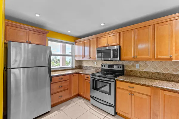 a kitchen with a sink a washer and dryer