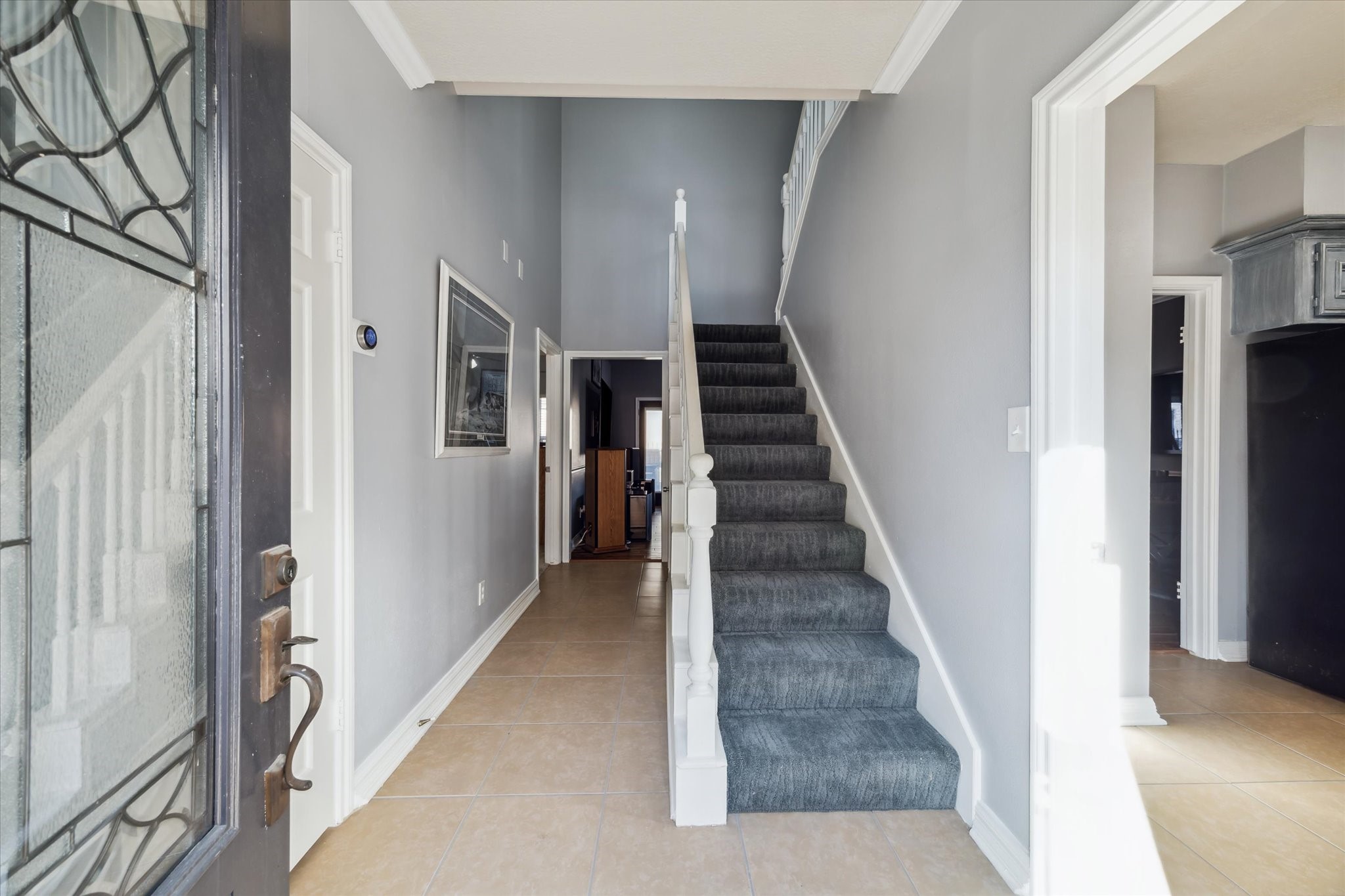 7671 Ameswood Road Houston, TX 77095 - Photo 13 of 23 Welcome inside this renovated freestanding patio home. New carpet on the stairs and in the upper bedrooms was installed in 2022.