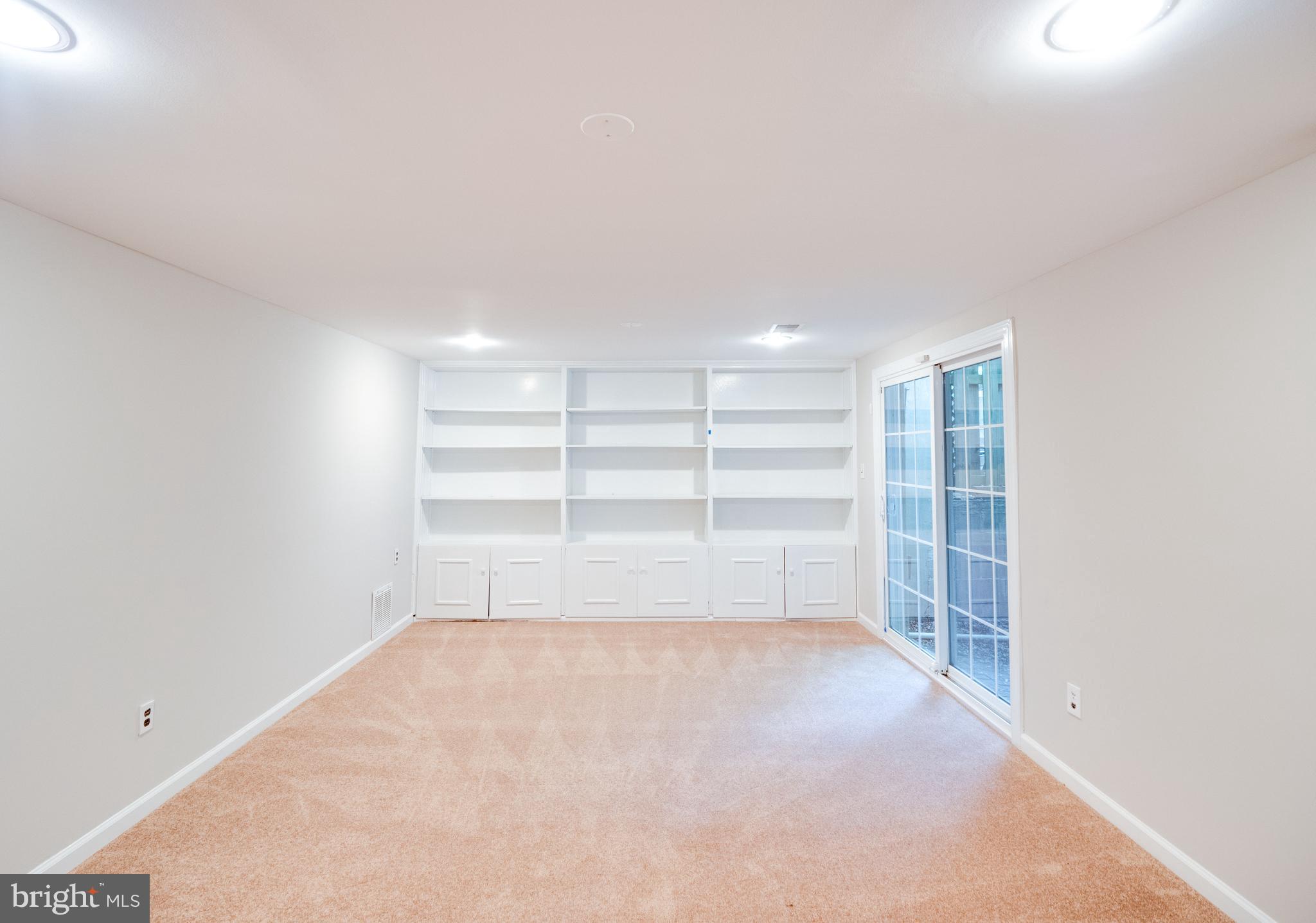 8352 Luce Court Springfield, VA 22153 - Photo 31 of 48 Spacious recreation room with built-ins