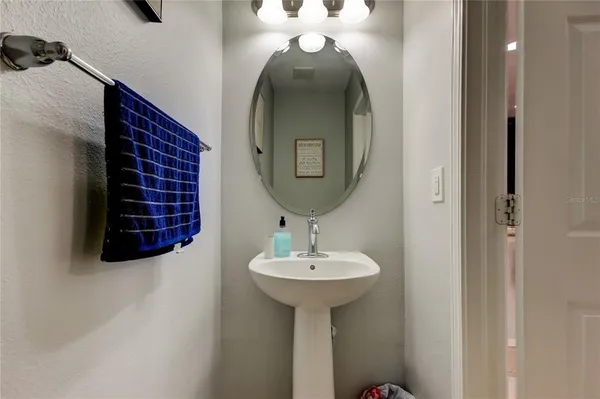 a bedroom with bed and a chandelier