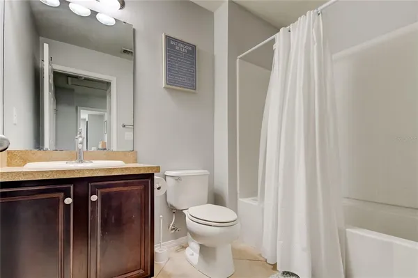 a view of a bedroom with washer and dryer